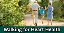 Walking for heart health. Grandparents walking and enjoying the day with their grandson.