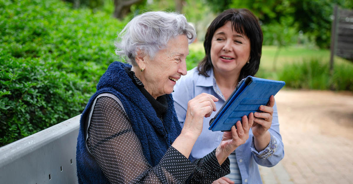 UTI Issues and Seniors. Ladies sharing a moment on the park bench.